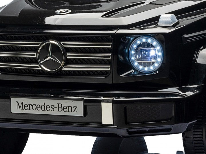 Mercedes-Benz G500 12V schwarz, Musik, Beleuchtung, Leder Sitze, Gummi Reifen